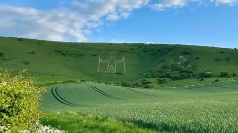 Grazyna Hammond A silhouette of a man on a hill 