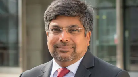 University of Leicester Prof Nishan Canagarajah outside the University of Leicester