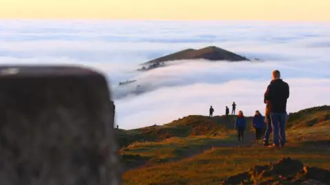 BBC Weather Watchers/Josh Walkers are on top of the hills as the peaks can be seen above the cloud on Friday.