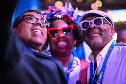 Brandon Bell / Getty Images Director and producer Spike Lee (right) poses for a selfie 