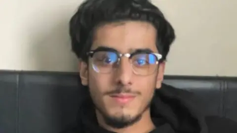 Sussex Police/Family handout Family photo of Mustafa Momand