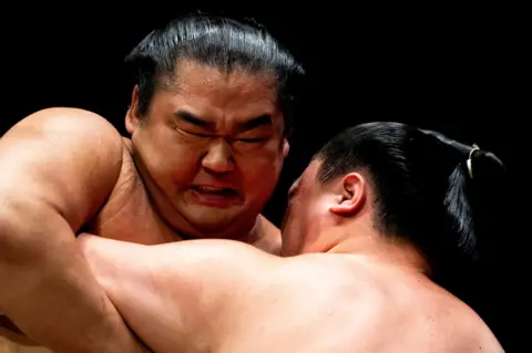 PA Media Tokihayate and Shonannoumi in the Makuuchi Division bout against Kotoeiho on day two of the Grand Sumo Tournament at the Royal Albert Hall, London