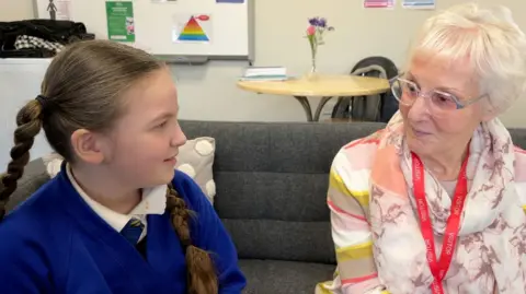 BBC The children learn how to share stories with the older generation.