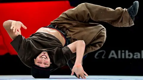 Marton Monus/Reuters Algeria's Mohamed Chakib in action at the Olympics breakdancing qualifiers