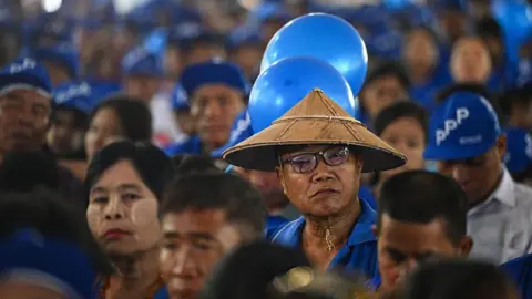 Supporters attend an election campaign event by Thet Thet Khine, chairperson of the People's Pioneer Party (PPP), in Yangon on December 25, 2025. 