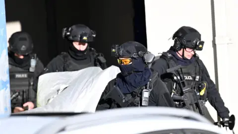 a group of firearms officers 