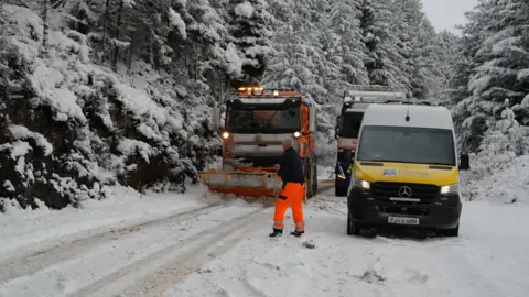 Vehicles stuck in snowy conditions on the A87 near Invergarry in the Scottish Highlands on Thursday