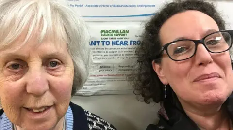 Jenny Harris Jenny Harris (right) with curly brown hair and black spectacles along with her mother.
