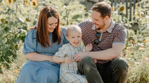 Mellon-Jameson family handout/PA Lucy, Jude and Arron Mellon-Jameson