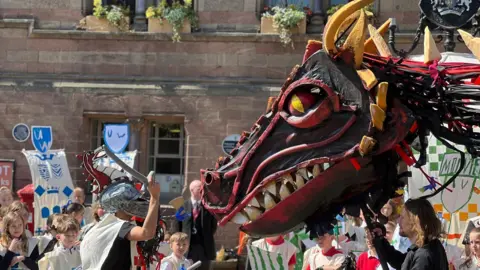 Knight and dragon meets in crowds in Chester
