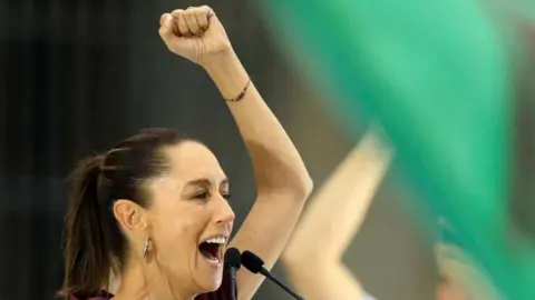 Reuters residential candidate of the ruling MORENA party Claudia Sheinbaum raises a fist as she delivers a speech during her closing campaign rally at Zocalo Square, in Mexico City, Mexico, May 29, 2024