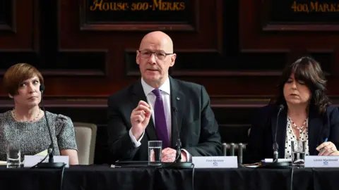 PA Media John Swinney at an "anti-far-right" summit in Glasgow last month.
