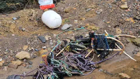 CLAIR MURGATROYD/BDMLR Discarded rope, tangled together with a broken lobster pot, pulled from the sea at Boggle Hole, near Robin Hood's Bay. 