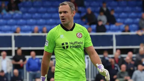 Craig Ross in goal for Woking