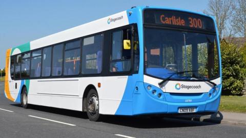 Blue and white stagecoach bus