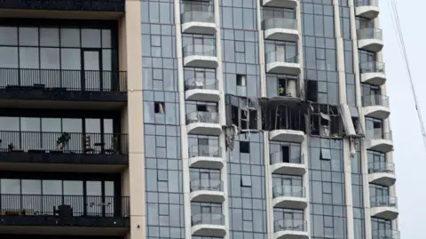 EPA A view of the damaged part of the Dubai Creek Harbour Tower after it was hit by an Iranian drone attack in Dubai, United Arab Emirates, 12 March 2026.