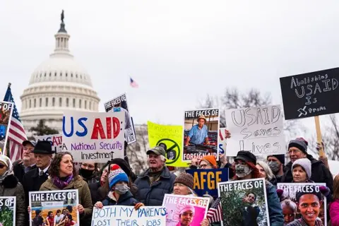planetnews Getty Images People protest against Trump administration's move to slash USAID