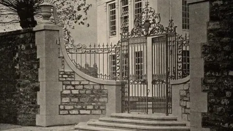 Friends of the Radcliffe Observatory Quarter Archive image of the large steel gates in front of the Radcliffe Infirmary Maternity Home.