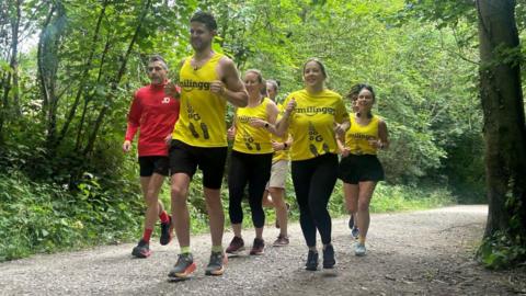 The East Grinstead running club run on a dirt track 