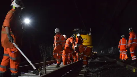 Network Rail Engineers positioning new track laid in the Severn Tunnel