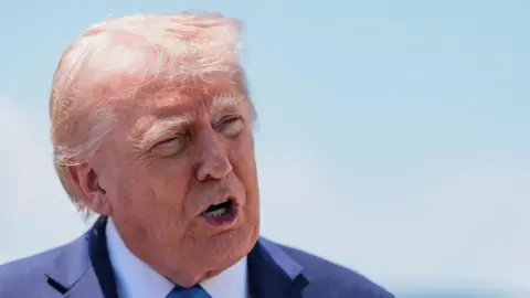 Reuters President Donald Trump speaks to the media before departing Palm Beach International Airport.