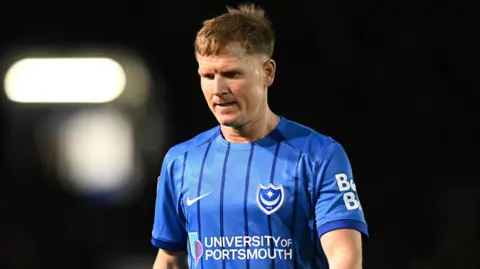 Portsmouth player Matt Ritchie looks on while on the pitch