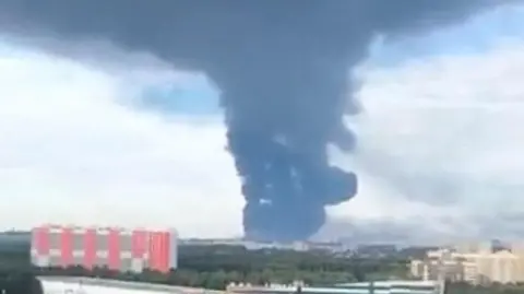 A large plume of smoke rising over Russia