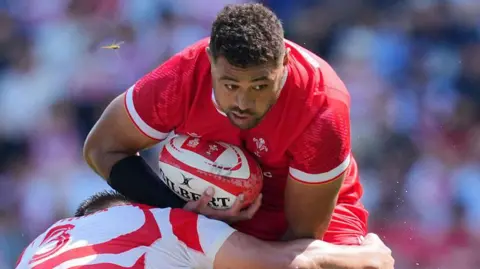Taulupe Faletau on the charge against Japan