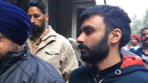 Jagtar Singh Johal (right) arrives at court in India in November 2017