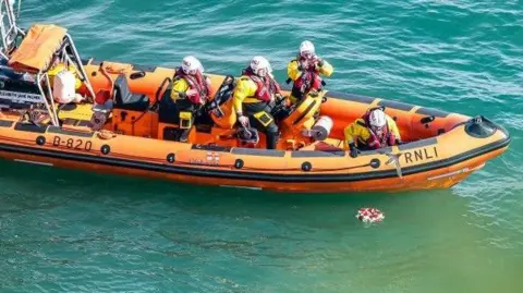 Rod Newton/Flamborough RNLI life boat laying wreath