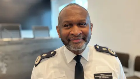 Met Police Deputy Assistant Commissioner Ade Adelekan in police uniform looking just off camera