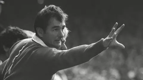 Brian Clough signals instructions to his Nottingham Forest players from the sideline in 1977