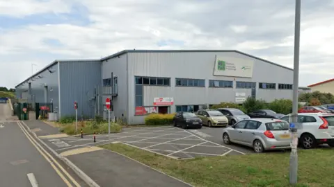 Google The outside of the Household Waste Recycling Centre in Fengate in Peterborough, which is a big steel building. There is a car park outside the front.