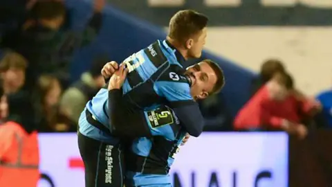 Callum Sheedy celebrates his winning kick with Cameron Winnett