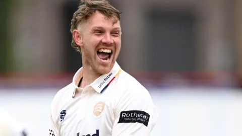 Jamie Porter celebrates taking wicket