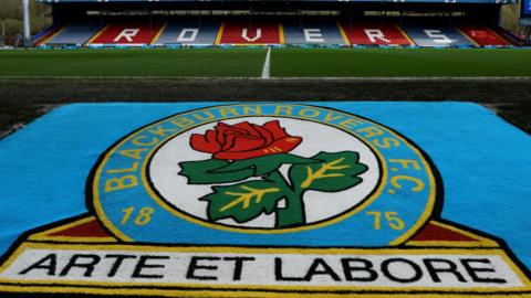 A picture of Blackburn's badge on the side of the pitch at Ewood Park