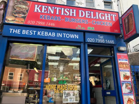 BBC The front door and signage of Kentish Delight kebab shop 