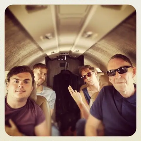 Author's collection What looks like a Polaroid picture of a band on a plane with Calvin Harris back left and Mike Pickering front right