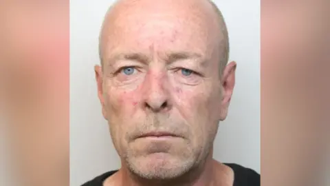 Derbyshire Police Custody photo showing Gary Stevens with grey background