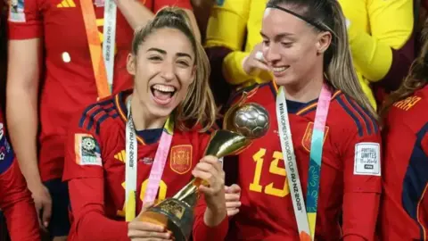 Getty Images Olga Carmona captain of Spanish team holds the Women's World Cup trophy after winning in 2023. 