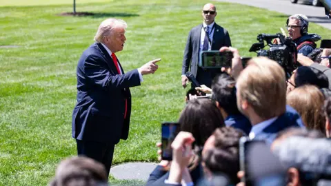US President Donald Trump speaks to the media on the White House lawn on Friday 1 May 2026
