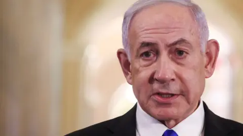 Reuters Benjamin Netanyahu speaks to reporters on Capitol Hill in Washington DC (8 July 2025)