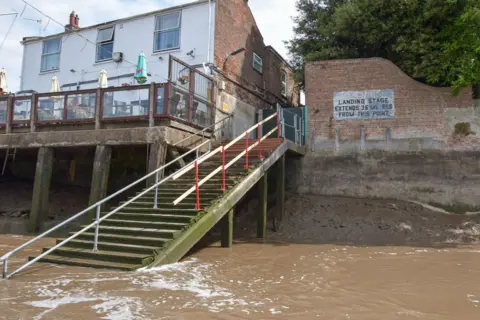 KLWNBC View of the West Lynn Ferry landing site at King's Lynn. A steep set of steps lead to the water.