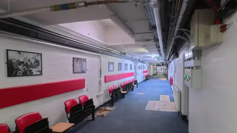 The Elstree Project Hallway with pictures on the walls.