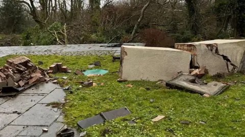 Sue Goddard Photo of collapsed chimney stack on a patio after a tornado