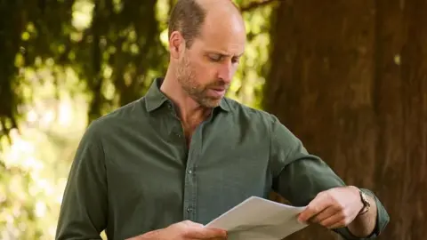 Image shows the Prince of Wales standing outside in a green shirt, recording opening scenes for new documentary series, Guardians