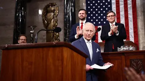 Charles speaks in Congress. Behind him is JD Vance and Mike Johnson.