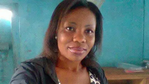 A head and shoulders image of a woman.
