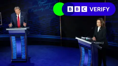 Getty Images Kamala Harris and Donald Trump stand at their podiums during the ABC News presidential debate.