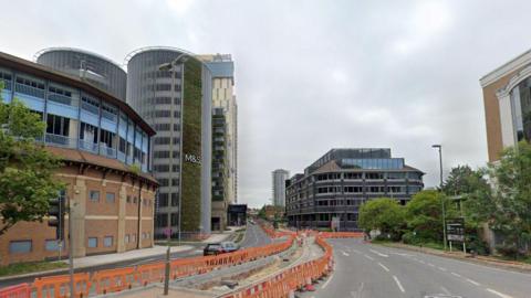 Victoria Way in Woking with M&S visible as well as roadworks in place